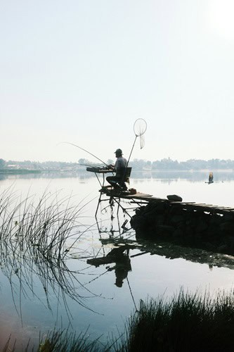 image of man fishing as one of his sources of pleasure